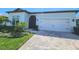 A lovely home with a charming walkway and a well-manicured lawn at 9024 Barrier Coast Trl, Parrish, FL 34219