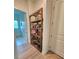 Hallway featuring a unique wooden bookshelf at 9024 Barrier Coast Trl, Parrish, FL 34219