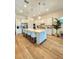 Spacious kitchen boasts a large island with seating and modern stainless steel appliances at 9024 Barrier Coast Trl, Parrish, FL 34219