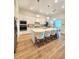 Bright and spacious kitchen features a center island, ample counter space, and modern appliances at 9024 Barrier Coast Trl, Parrish, FL 34219