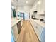 Modern kitchen with an island and sleek appliances at 9024 Barrier Coast Trl, Parrish, FL 34219