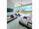 Relaxing screened-in patio with comfortable seating and a view of the pool at 9024 Barrier Coast Trl, Parrish, FL 34219