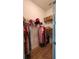 Organized walk-in closet with ample shelving and hanging space for clothes and accessories at 9024 Barrier Coast Trl, Parrish, FL 34219