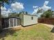 Backyard featuring a metal shed and wood fencing at 932 W Wheeler Rd, Brandon, FL 33510