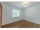 Bedroom with wood floor and window providing ample natural light at 932 W Wheeler Rd, Brandon, FL 33510