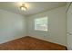Bedroom features wood floor, window, and ample space for comfortable living at 932 W Wheeler Rd, Brandon, FL 33510