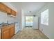 Bright kitchen includes white appliances, access to the exterior, and a clean, functional layout at 932 W Wheeler Rd, Brandon, FL 33510