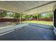 View from a screened lanai overlooking a spacious backyard with a wooden fence at 932 W Wheeler Rd, Brandon, FL 33510
