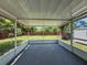 View of the screened lanai overlooking the backyard and shed at 932 W Wheeler Rd, Brandon, FL 33510