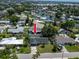Aerial view with an arrow showing location amongst surrounding homes in a coastal neighborhood with waterfront access at 621 Gran Kaymen Way, Apollo Beach, FL 33572