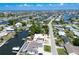 Aerial view of the community showing the intercoastal waterway running throughout with homes, boats and stunning blue skies at 621 Gran Kaymen Way, Apollo Beach, FL 33572