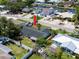 Aerial view of home displaying a backyard with a white privacy fence and neighborhood street view at 621 Gran Kaymen Way, Apollo Beach, FL 33572