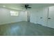 Bedroom featuring neutral walls, a ceiling fan, and luxury tile flooring at 621 Gran Kaymen Way, Apollo Beach, FL 33572