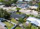 An aerial view of the home showing the fenced in yard, dark shingled roof, and convenient location at 621 Gran Kaymen Way, Apollo Beach, FL 33572