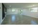 Spacious living room with lots of natural light and stylish tile flooring at 621 Gran Kaymen Way, Apollo Beach, FL 33572