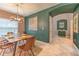 Dining area with stylish decor, modern lighting and an adjacent butler's pantry at 10081 Sage Creek Dr, Sun City Center, FL 33573