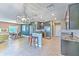 Open kitchen with granite counters, an island, and stainless steel appliances at 10081 Sage Creek Dr, Sun City Center, FL 33573