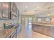 Spacious kitchen with granite countertops, stainless steel appliances and outdoor access at 10081 Sage Creek Dr, Sun City Center, FL 33573