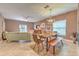 Open-concept living space with dining area, comfortable seating, and ample natural light at 10081 Sage Creek Dr, Sun City Center, FL 33573