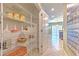 Well-organized pantry with metal shelving, offering ample storage space and organization at 10081 Sage Creek Dr, Sun City Center, FL 33573