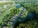 Aerial view showcasing a neighborhood with houses near the golf course, featuring swimming pools, trees, and scenic landscaping at 10513 Palm Cove Ave, Tampa, FL 33647