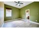 Cozy bedroom with window, natural light, and olive green walls at 10513 Palm Cove Ave, Tampa, FL 33647
