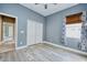 Spacious bedroom features a window and closet with mirrored doors at 10513 Palm Cove Ave, Tampa, FL 33647
