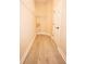 Walk-in closet featuring hardwood floors, wire shelving and ample storage space at 10513 Palm Cove Ave, Tampa, FL 33647