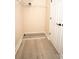 Walk-in closet featuring hardwood floors, wire shelving and ample storage space at 10513 Palm Cove Ave, Tampa, FL 33647