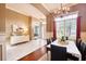 Inviting dining room with natural light, a modern chandelier, and a marble-topped dining table at 10513 Palm Cove Ave, Tampa, FL 33647