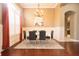 Formal dining room with modern chandelier, wainscoting, and ample space for Gathering gatherings at 10513 Palm Cove Ave, Tampa, FL 33647
