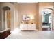 Elegant foyer featuring marble tile flooring, arched doorways, and a stylish console table at 10513 Palm Cove Ave, Tampa, FL 33647
