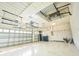 Large garage offering abundant storage solutions with overhead racks and a clean, organized space at 10513 Palm Cove Ave, Tampa, FL 33647