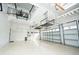 Spacious garage with ample storage space, shelving, and overhead racks, perfect for organization at 10513 Palm Cove Ave, Tampa, FL 33647