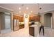 Contemporary kitchen with stainless steel appliances, granite counters and a breakfast bar at 10513 Palm Cove Ave, Tampa, FL 33647