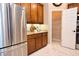 Kitchen with stainless steel appliances, granite countertops, and a view into the pantry at 10513 Palm Cove Ave, Tampa, FL 33647