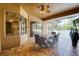 The covered lanai features brick pavers, outdoor dining, and an attached pool at 10513 Palm Cove Ave, Tampa, FL 33647