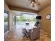 The covered lanai features brick pavers and outdoor dining at 10513 Palm Cove Ave, Tampa, FL 33647