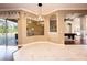Spacious area with tile floors offers views of the pool, and connects to other living areas at 10513 Palm Cove Ave, Tampa, FL 33647