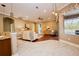 Bright, open-concept living room featuring hardwood floors and an abundance of natural light at 10513 Palm Cove Ave, Tampa, FL 33647