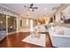 Open living room with hardwood floors, large sliding doors to lanai, and modern decor at 10513 Palm Cove Ave, Tampa, FL 33647