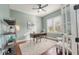 Office with an area rug, desk, shelving, and a window providing natural light at 10513 Palm Cove Ave, Tampa, FL 33647