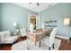 A stylish home office featuring a modern desk, comfortable seating, and ample natural light at 10513 Palm Cove Ave, Tampa, FL 33647