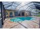 The private pool is enclosed with an attached lanai at 10513 Palm Cove Ave, Tampa, FL 33647