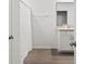 A bathroom featuring a shower and white cabinet with a sink, with neutral tiling at 10823 Trailing Vine Dr, Tampa, FL 33610