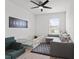 Bright bedroom with a baby play-yard and sectional sofa for comfortable playtime at 10823 Trailing Vine Dr, Tampa, FL 33610