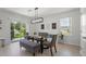 Bright dining area with light fixture, table, chairs and bench seating at 10823 Trailing Vine Dr, Tampa, FL 33610