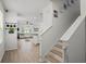 Bright entryway featuring modern flooring, staircase, and seamless transition to the living area at 10823 Trailing Vine Dr, Tampa, FL 33610