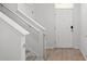 Well-lit entryway with modern flooring, white walls, and a secure front door at 10823 Trailing Vine Dr, Tampa, FL 33610