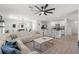 Open floor plan with kitchen, dining area, and living room at 10823 Trailing Vine Dr, Tampa, FL 33610